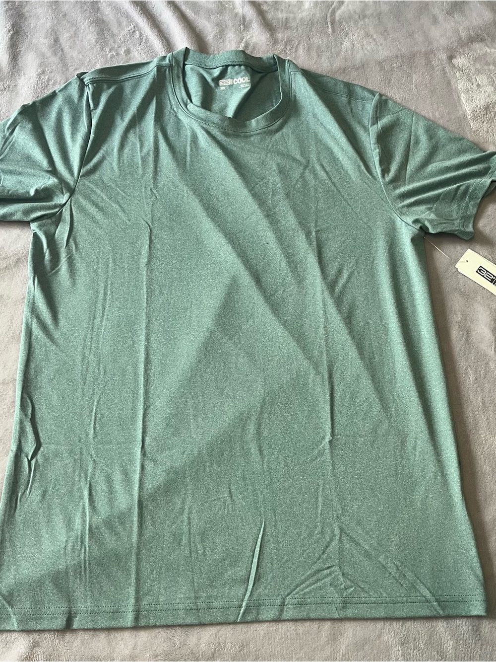 Soft green short-sleeve active tee. Lightweight, breathable fabric